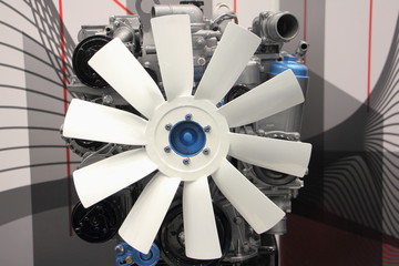 New industrial & truck engine motor with air propetter fan cooler close up, front view