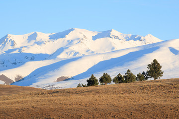 Snow covered mountains outside Lake Wanaka South Island New Zealand at sunrise
