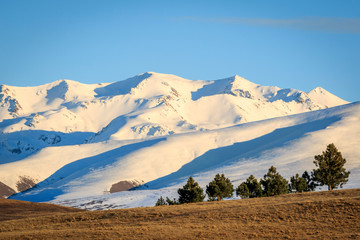 Snow covered mountains outside Lake Wanaka South Island New Zealand at sunrise