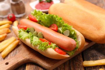 hot dog with sausage and salad