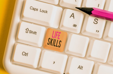 Conceptual hand writing showing Life Skills. Concept meaning that is necessary or desirable full participation in everyday White pc keyboard with note paper above the white background