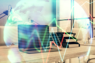 Stock market chart with globe hologram and desktop office computer background. Multi exposure. Concept of financial analysis.