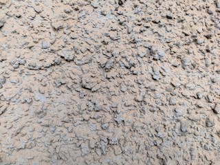 A wall of grey house with dots