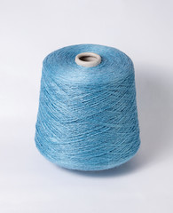 bobbin of yarn on a white background. Side view.Textile reel on isolated white background.