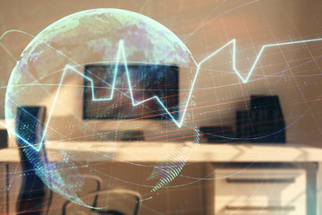 Stock market chart with globe hologram and desktop office computer background. Multi exposure....