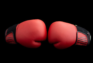 Red boxing gloves on a black background
