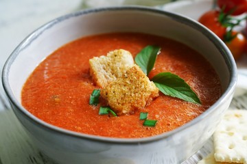Homemade creamy Tomao Soup served in a bowl, selective focus