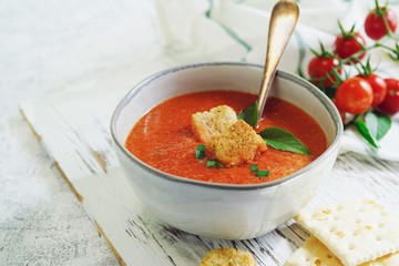 Homemade creamy Tomao Soup served in a bowl, selective focus