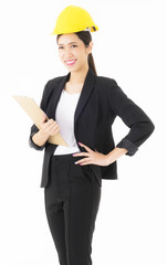 Portrait smiling Asian young engineer woman Yellow Safety helmet standing  Hold file documents. The model stood looking at the camera copy space isolated on white background studio horizontal image