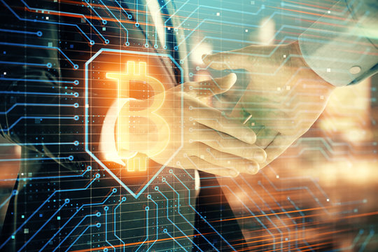 Double exposure of crypto economy theme drawing on cityscape background with handshake. Concept of partnership and blockchain
