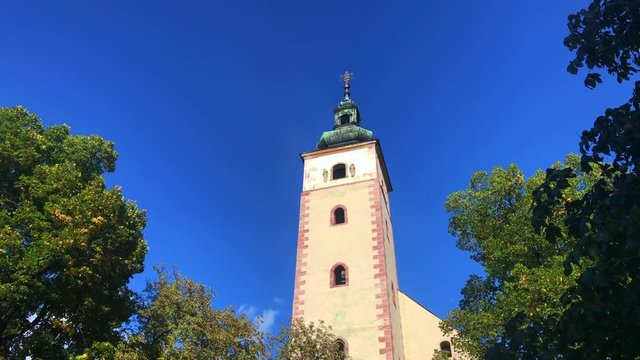 Tourist attraction in Banska Bystrica, Slovakia - Church of the Assumption of the Blessed Virgin Mary. Old gothic church. Exterior in sunny day. Parish church.