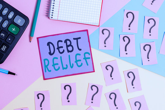Handwriting text Debt Relief. Conceptual photo partial or total remission of it especially those by countries Mathematics stuff and writing equipment above pastel colours background