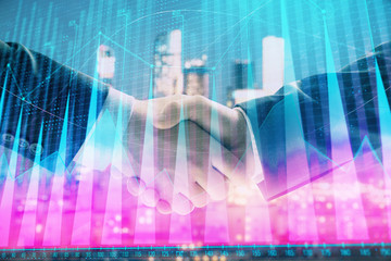 Double exposure of financial chart on cityscape background with two businessmen handshake. Concept of financial analysis and investment opportunities