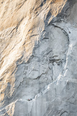 Close up of a side of El Capitan granite monolith in the late afternoon light