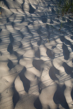 Abstract Sand Dunes with Rhythmic Shadows and Wavy Texture