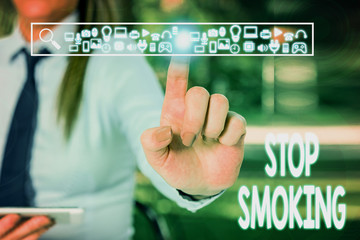 Fototapeta na wymiar Handwriting text writing Stop Smoking. Conceptual photo Discontinuing or stopping the use of tobacco addiction Woman wear formal work suit presenting presentation using smart device