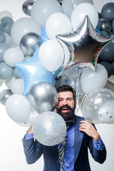 Birthday, preparing to party, celebration. Stylish birthday guy hold balloons. Happy businessman with helium balloons. Bearded man with balloons at birthday party. Handsome man with bunch of balloons.