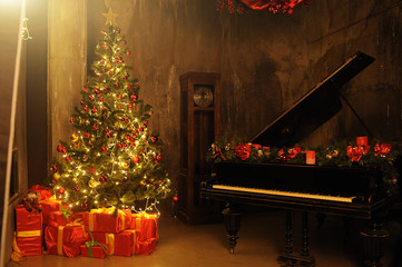 Evening christmas with christas tree and many gift box near piano