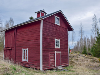 picture with Scandinavian-style red very old wooden house, wooden tile roof