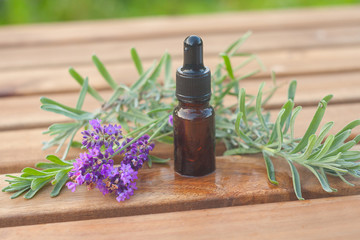 lavender essential oil in  beautiful bottle on table