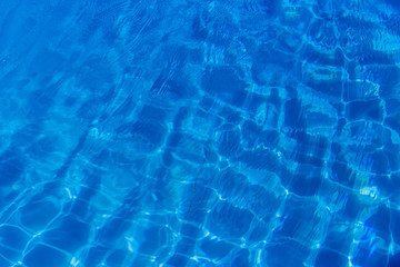 Clear blue water in swimming pool