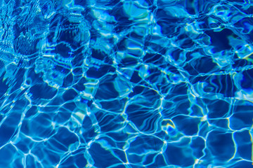 Clear blue water in swimming pool