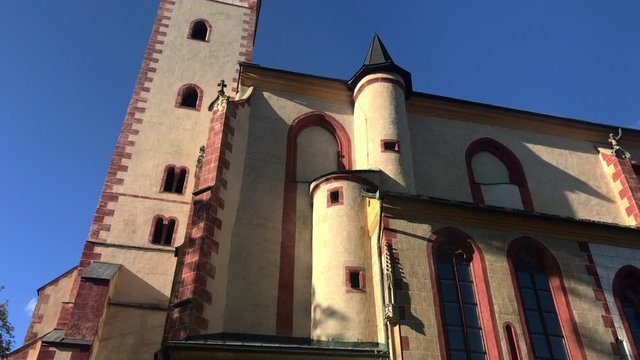 Tourist attraction in Banska Bystrica, Slovakia - Church of the Assumption of the Blessed Virgin Mary. Old gothic church. Exterior in sunny day. Parish church.