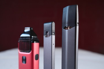 3 different vape pen electronic cigarette devices product shot isolated close up