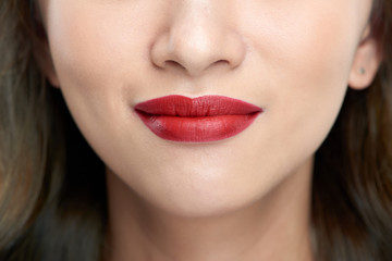 Fototapeta premium Female lips closeup. Beautiful smile of young fresh woman.