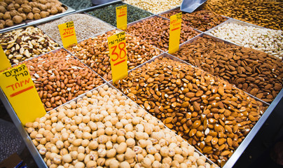 Variety of nuts at Mahane Yehuda market in Jerusalem. Food concept background.