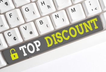 Handwriting text Top Discount. Conceptual photo Best Price Guaranteed Hot Items Crazy Sale Promotions White pc keyboard with empty note paper above white background key copy space