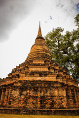 Fototapeta premium Wat Mahathat Temple in the precinct of Sukhothai Historical Park, Wat Mahathat Temple is UNESCO World Heritage Site, Thailand.