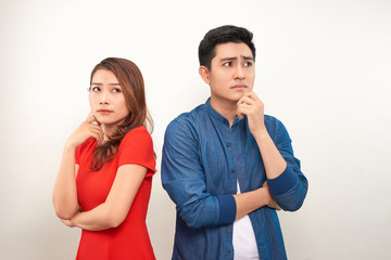 Young angry couple in love standing back to back