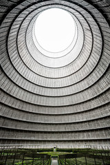 Wide angle shot of the interior of an abandoned power plant's cooling tower