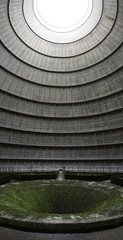 Wide angle shot of the interior of an abandoned power plant's cooling tower