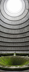 Wide angle shot of the interior of an abandoned power plant's cooling tower