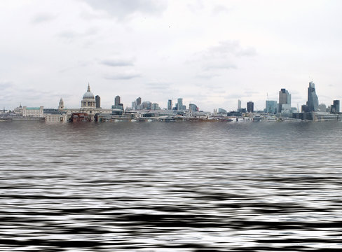 Manipulated Conceptual Image Of The City Of London With Buildings Flooded Due To Global Warming And Rising Sea Levels And Gulls