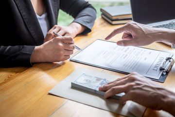 Dishonest cheating in business illegal money, Businessman giving bribe money in envelope to business people to give success the deal contract of investment, Bribery and corruption concept