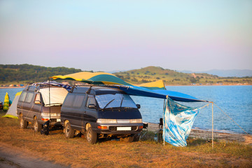 Seashore camping with two vans