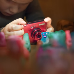 Role games. Toys sculpted from plasticine. Boy playing with toys. Child 4 - 5 years old get bored....