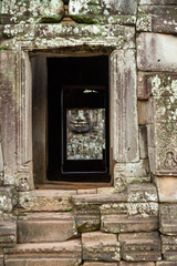 Angkor Wat faces through doorway
