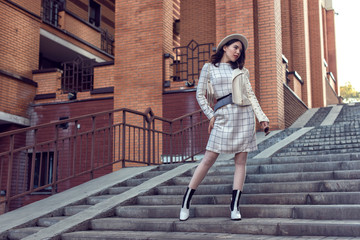 Stylish young girl in an autumn look