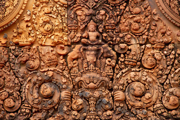 Fototapeta na wymiar Carved details from Angkor Wat, snakes, dragons, closeup