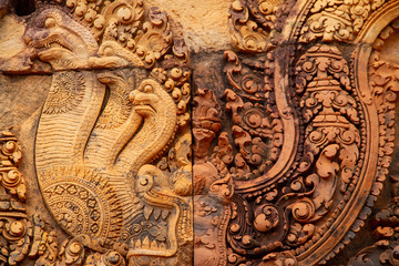 Carved details from Angkor Wat, snakes, dragons, closeup