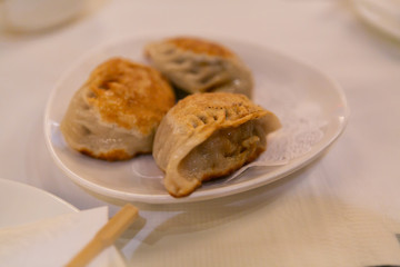 Pork pan fried dumplings at dim sum restaurant