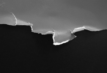 pieces of torn paper texture on black background