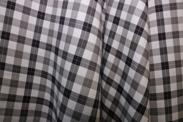 red fabric texture of checkered picnic blanket