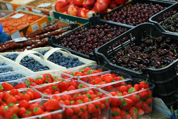 Market. Berries. Selling. Blueberry and strawberry. Raspberries, cherries.