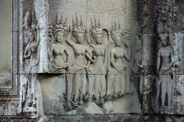 Angkor Wat ladies, relief carving in stone, closeup