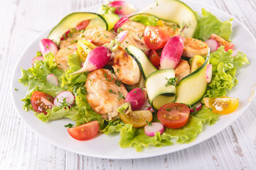 vegetable salad with chicken fillet and radish